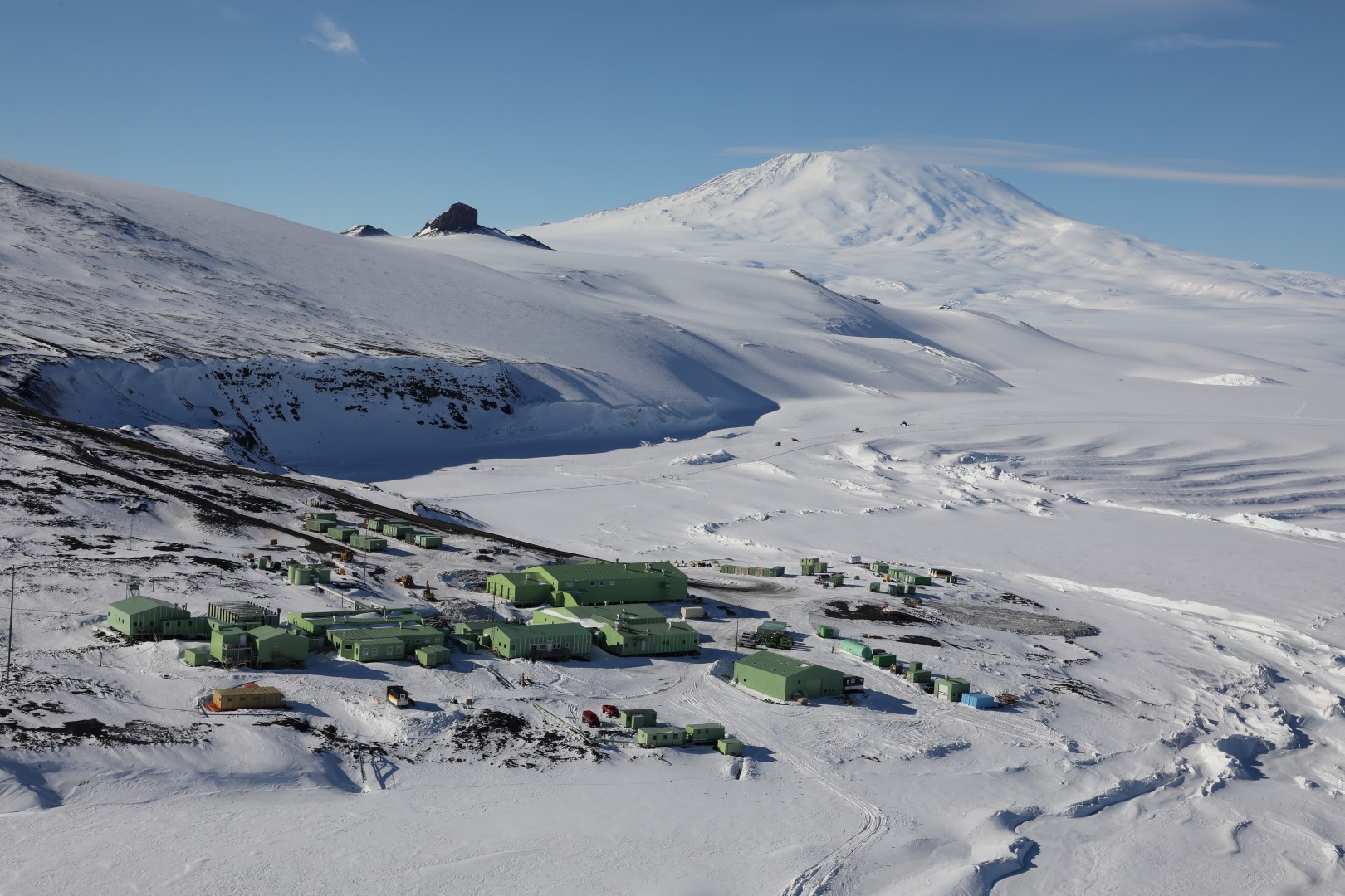 The Scott Base Antarctic research facility located at Pram Point on Ross Island. Mount Erebus is also pictured in the background.