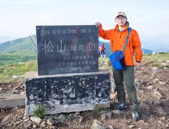 New NeSI team member Dafei Wu standing on mountain summit