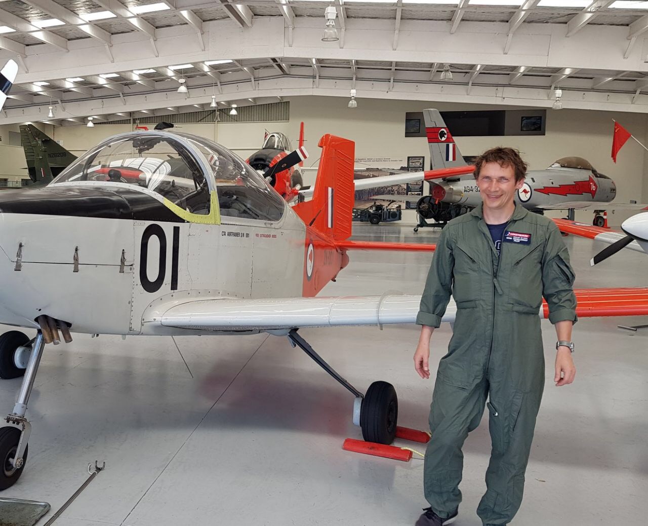 New NeSI team member Gene Soudlenkov standing by a plane