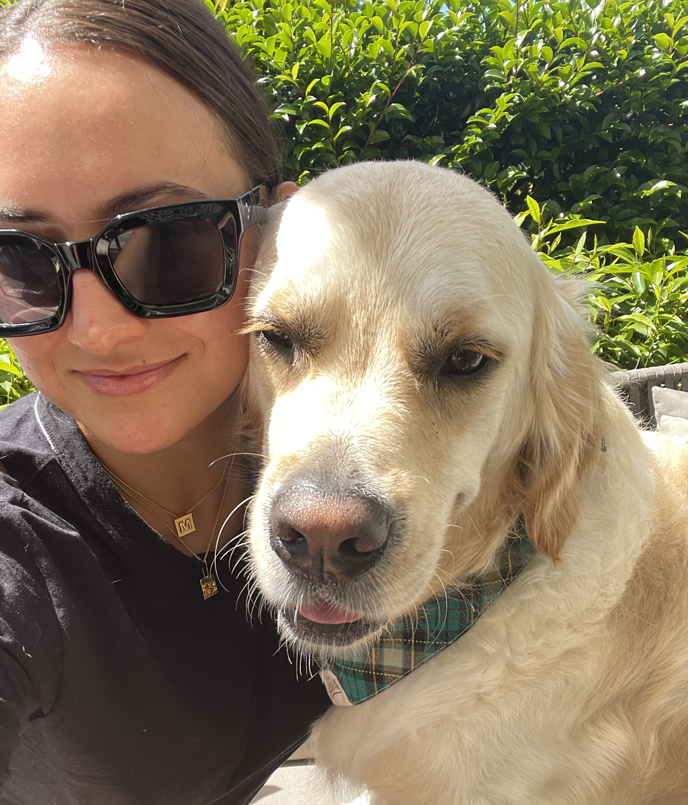 A picture of Mercedes and her golden labrador dog, Billy.