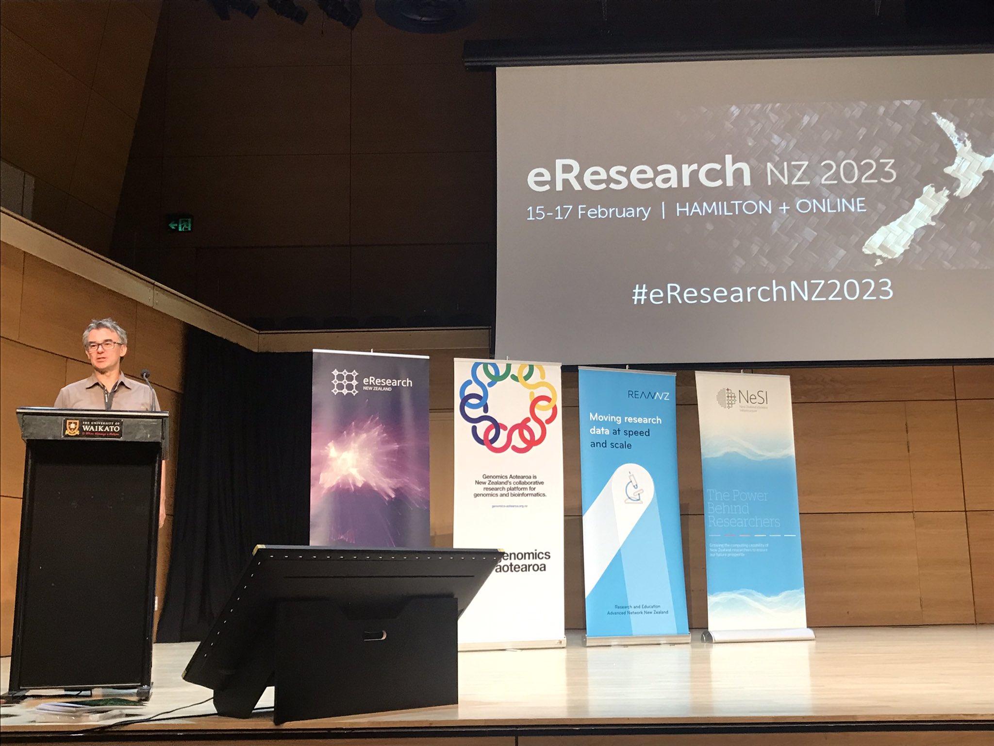 Mik Black on stage at the 2023 eResearch NZ conference.