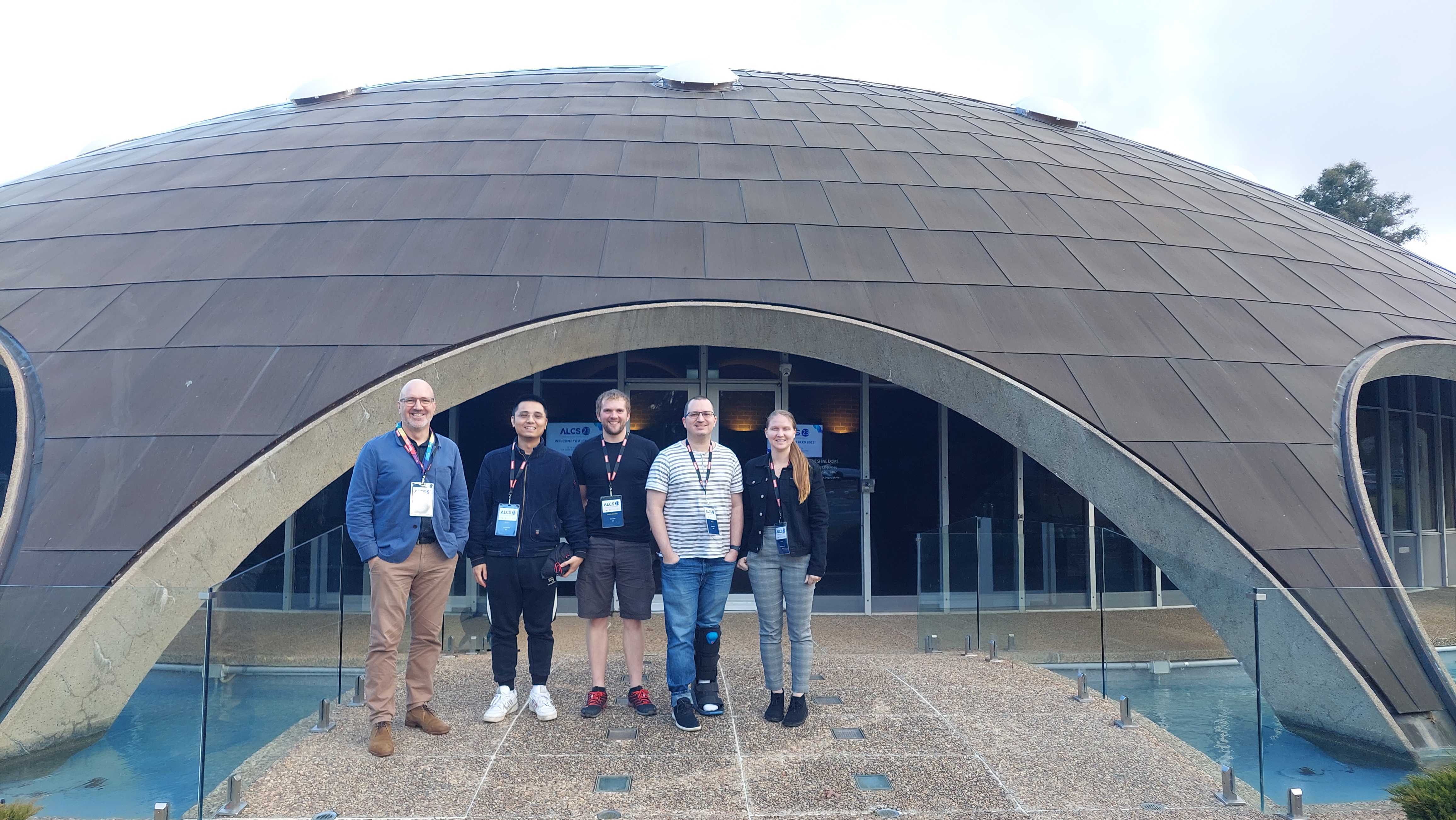 (Pictured left to right: Nick Jones (NeSI Director), Fei (Travis) Dai, Chris Scott (NeSI Research Software Engineer), Joseph Guhlin, and Hannah Kessenich)