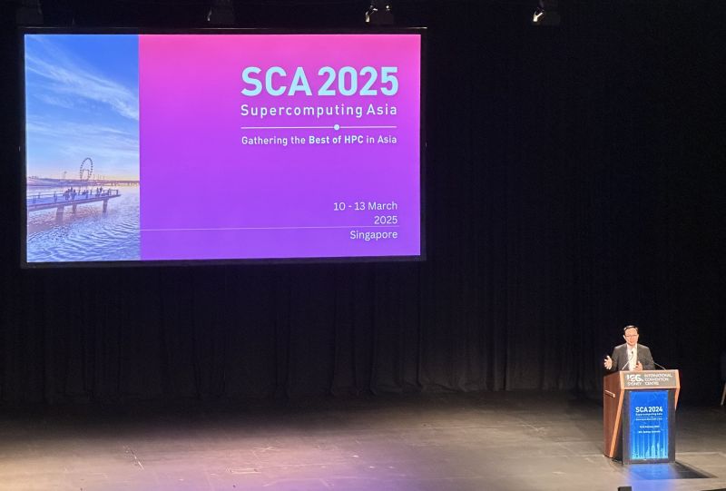 A photo of a speaker announcing the dates for SCAsia 2025.