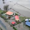 Aerial view of floodwaters surrounding farmhouses. Photo credit Alan Blacklock, NIWA.